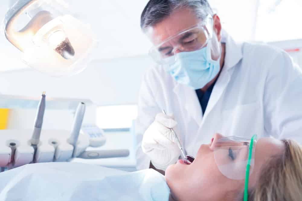 Dentist Examining A Patients Teeth