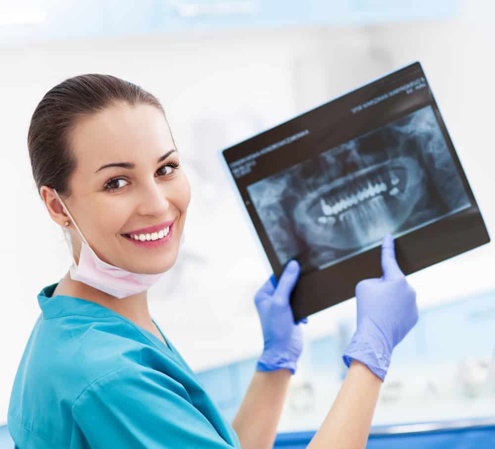 Female Dentist With X-ray Picture